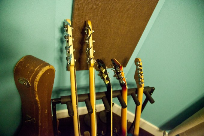 Guitars and basses all lined up